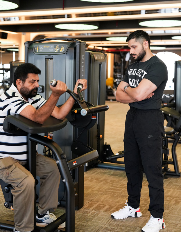 Sukh coaching a client at City Fitness Auckland